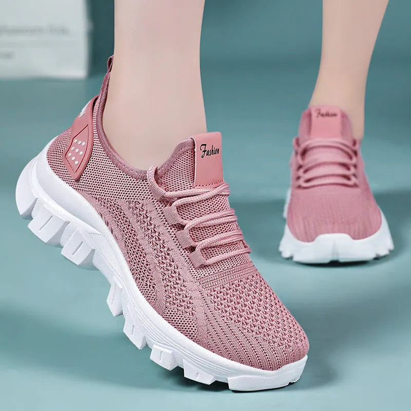 Women's Flyknit sneakers in white colour with round toe and lace-up front