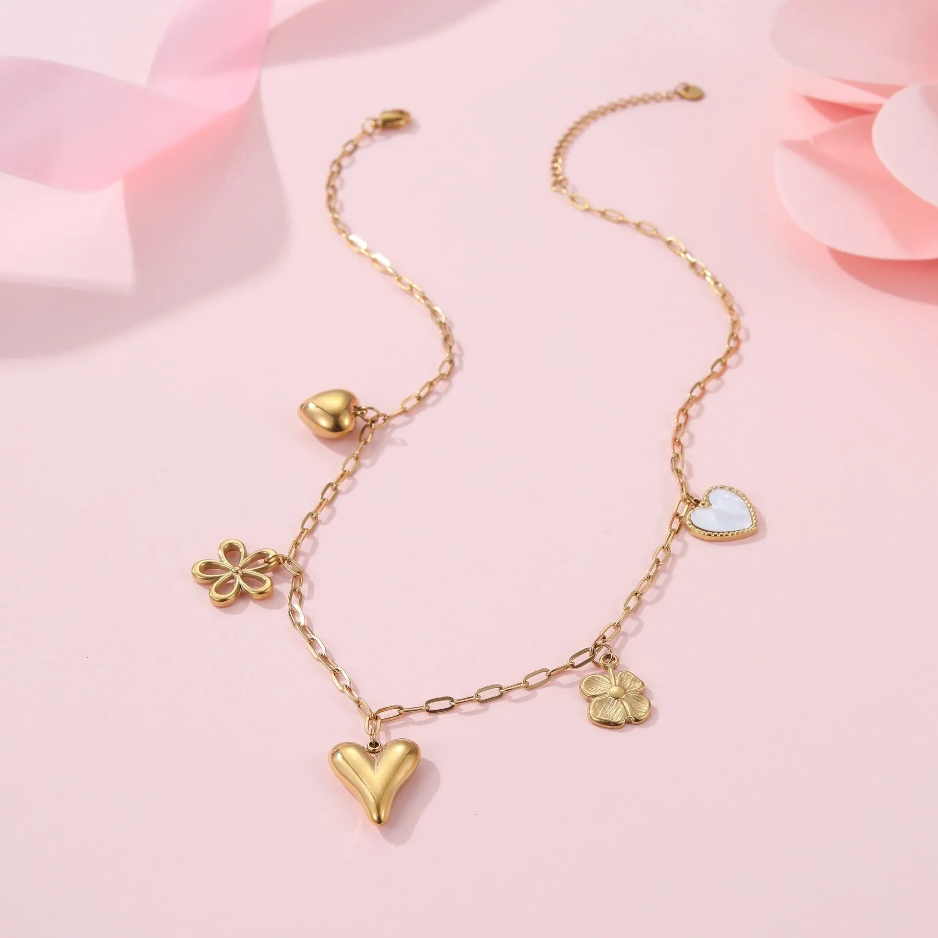Sun Love pendant necklace in stainless steel with 18K electroplate, showing Heart and Ribbon Sun design options.