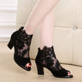 Black lace women's gladiator sandals with a square high heel and peep toe.