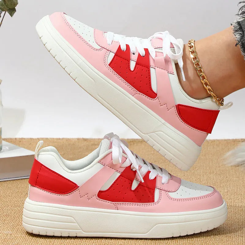 Pair of solid colour low heel lace-up board shoes with artificial PU upper and rubber sole