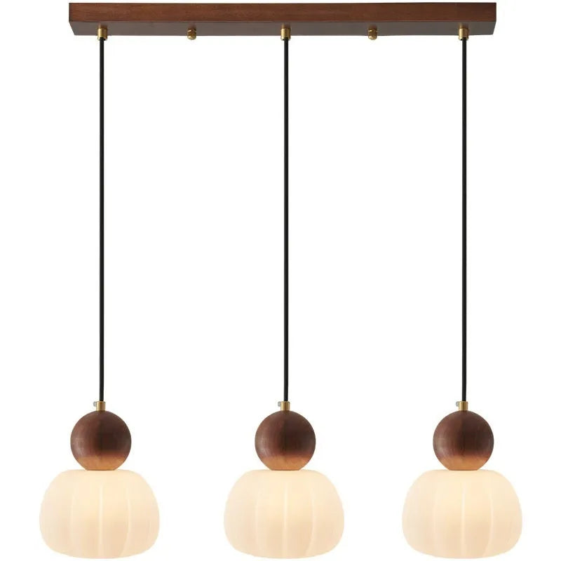 Creative alloy pumpkin chandelier light fixture for ceiling mounting in cream, red, green, chrome, or walnut finish.