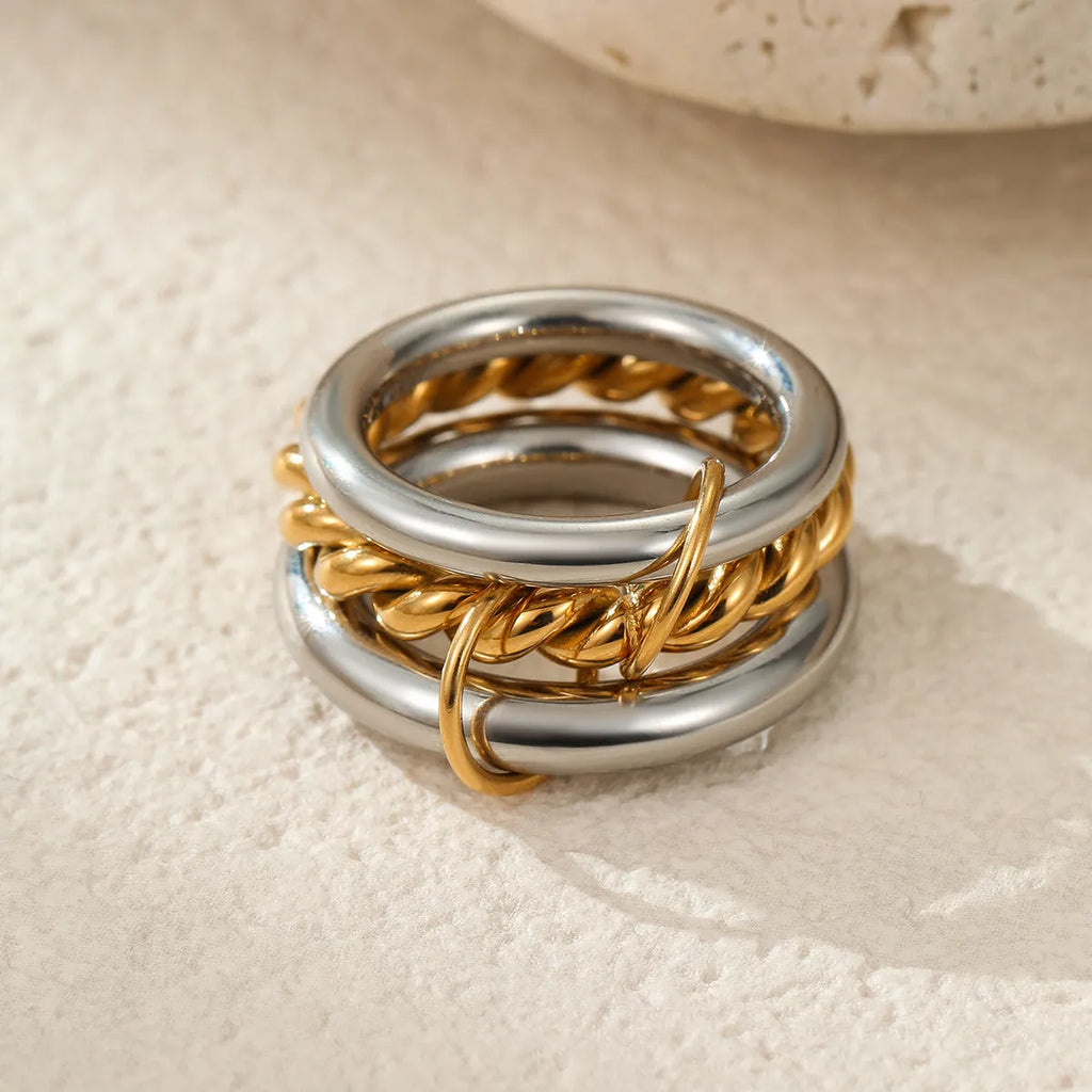 A stacked stainless steel ring set with 18K gold plating in an exaggerated design for women.