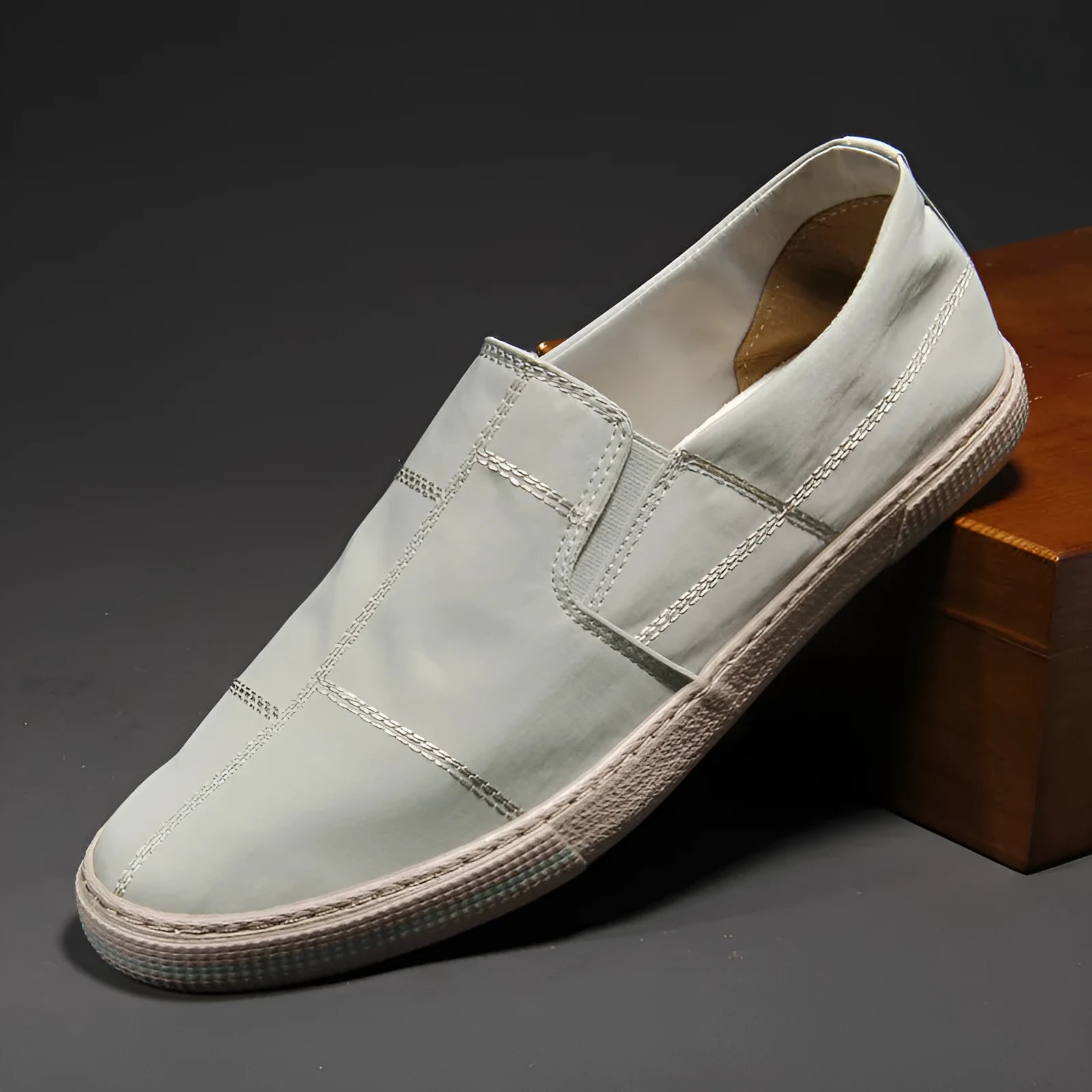 Men's low-top slip-on canvas shoes in multiple colours on a flat rubber sole with a square heel.