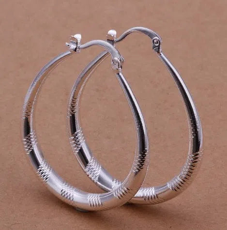 Creative silver tone hoop earrings with copper core and 925 silver plating, 3.9cm by 3.2cm