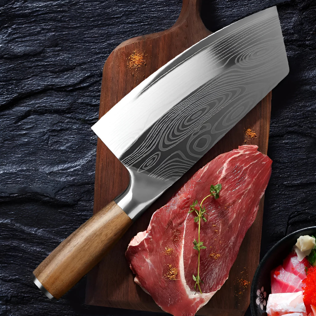 A stainless steel kitchen knife with a 320mm blade on a wooden cutting board.