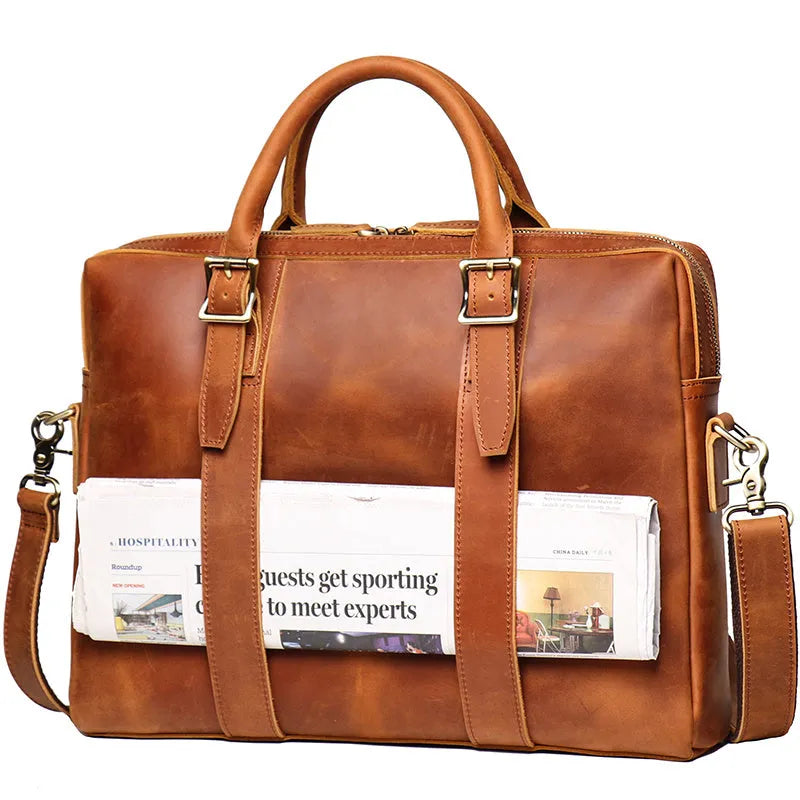 Men's large brown cow leather vintage handbag with zip closure, handle, shoulder strap, and 15 inch laptop space