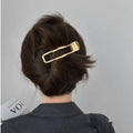 Gold and silver zinc alloy barrettes in square, arc, and triangle shapes for women.