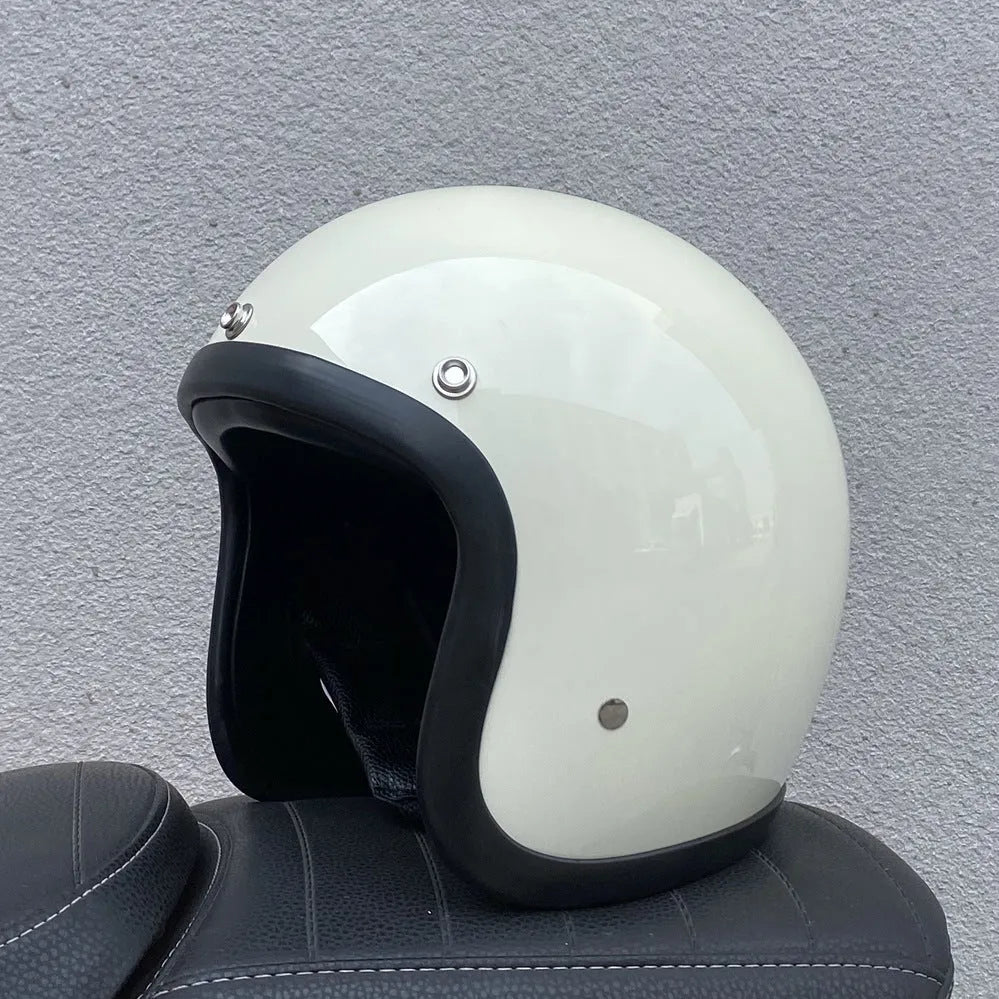 Retro-style open-face motorcycle half helmet in cement grey with a glossy FRP shell and quick-release chin strap.