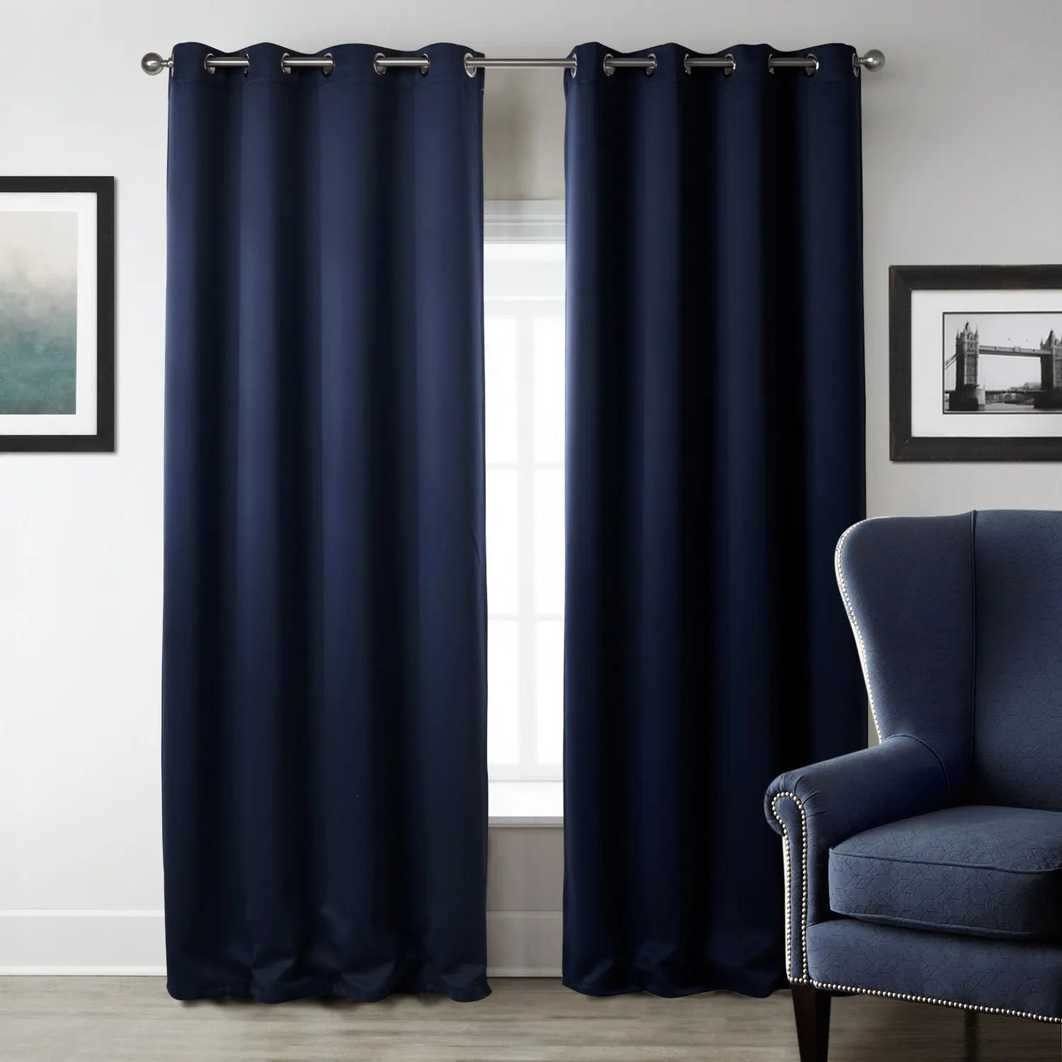 Dark navy blue blackout curtain hanging, showing its modern simple style and light-blocking fabric.