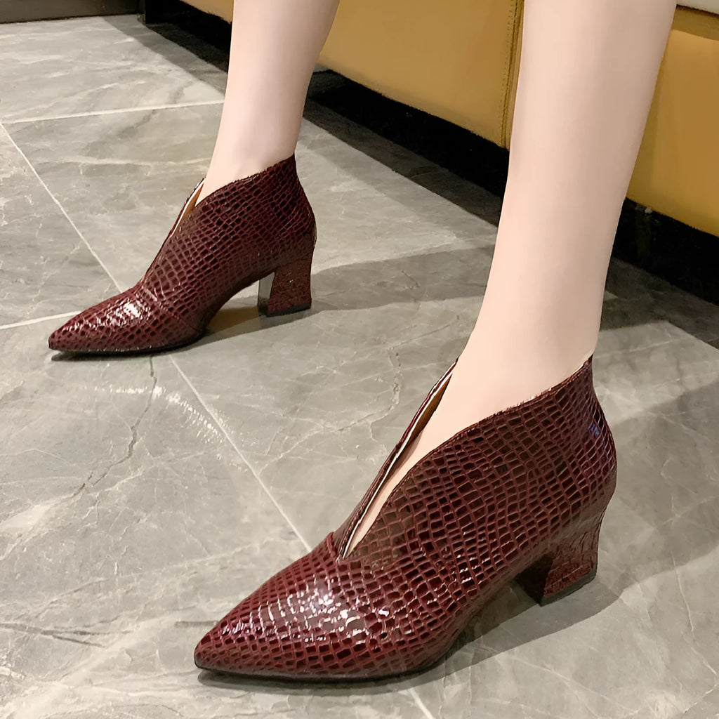 Women's black V cut pointed toe ankle boots with embossed detailing and chunky heel