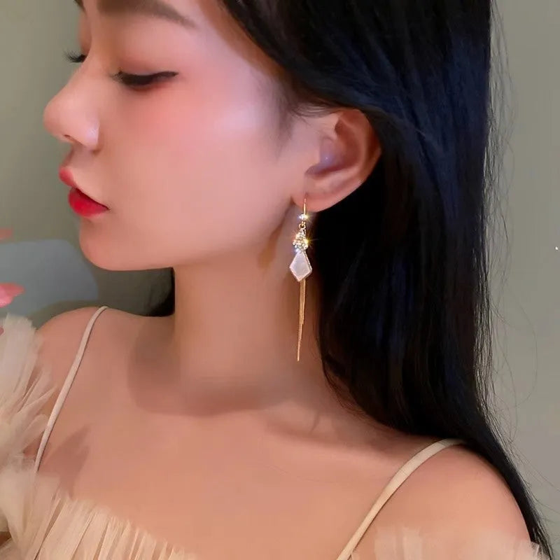 Alloy tassel strip earrings with gang diamond ice flower and eight awn star design in white and black