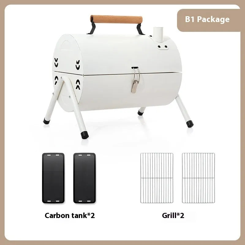 White round portable folding chimney grill with two carbon tanks and mesh grills on grass