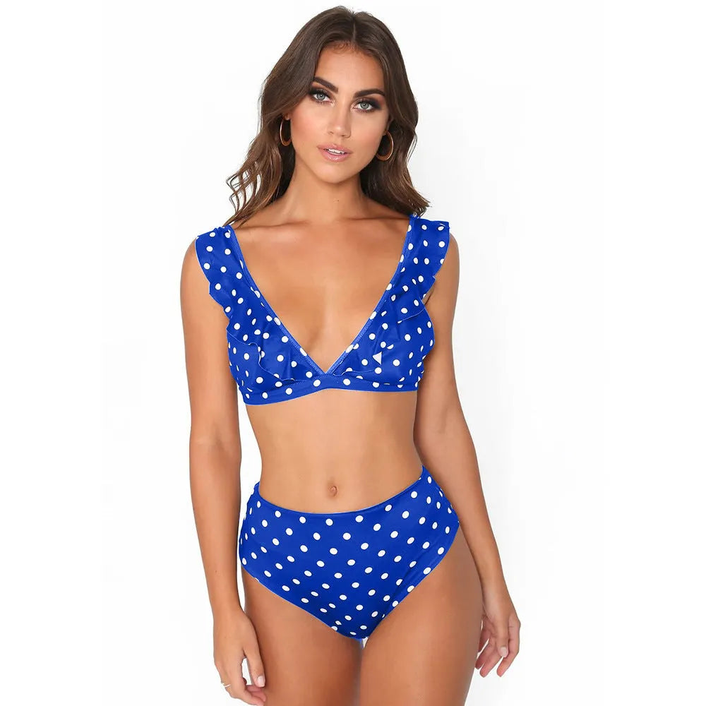 Women's black and white polka dot bikini set with ruffled deep V-neck top and matching shorts