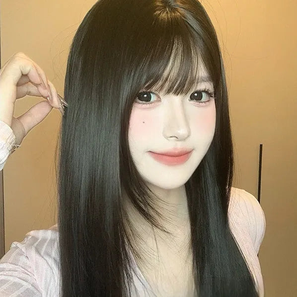Dark brown long straight synthetic wig with bangs on a wig stand