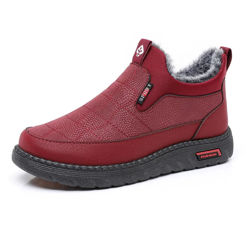 Women's black casual flat ankle boots with round toe and synthetic leather upper on a neutral background.
