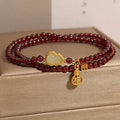 Antique style Chinese bracelet with U-shaped design and floral red garnet imitation gemstones