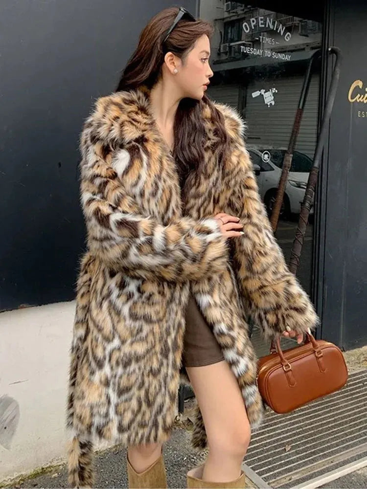 A long faux fur coat with a fox fur-style collar, shown in a street fashion context.