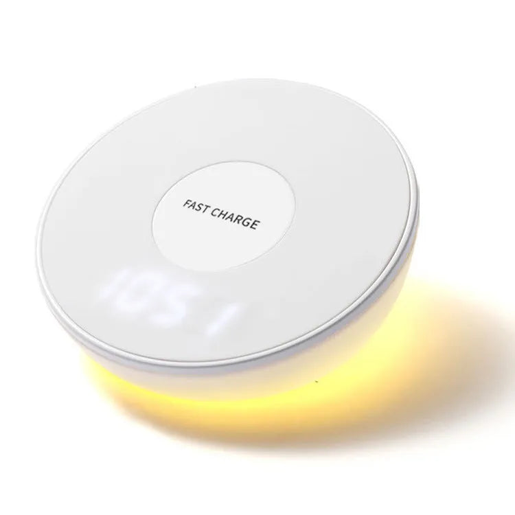 White wireless charging pad with LED clock display showing time, three control buttons, and Qi charging surface for smartphones