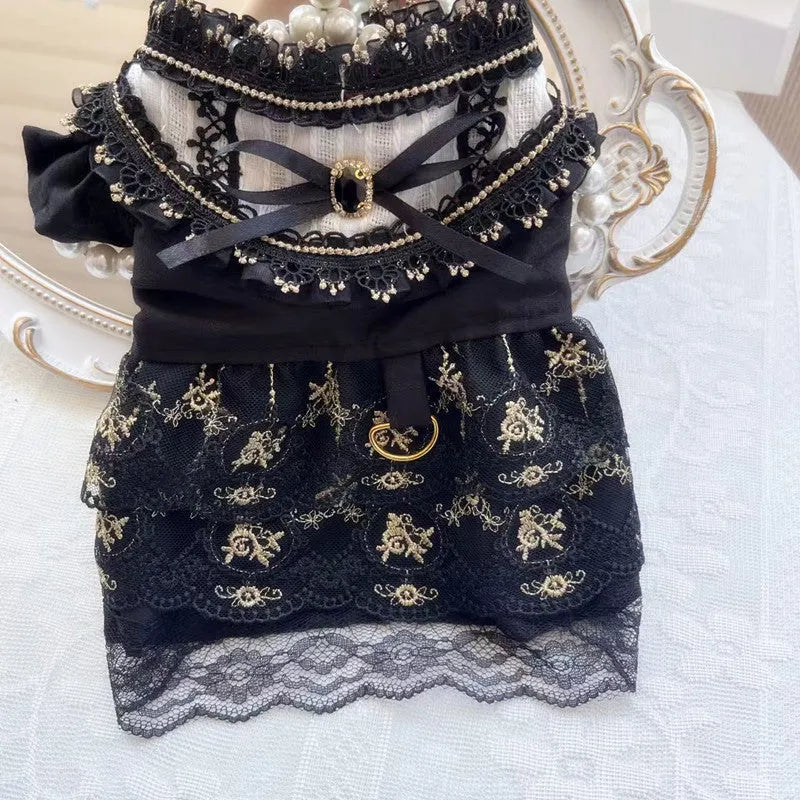 Golden layered gothic-style skirt for a small dog or cat on a mannequin, showing princess cut.