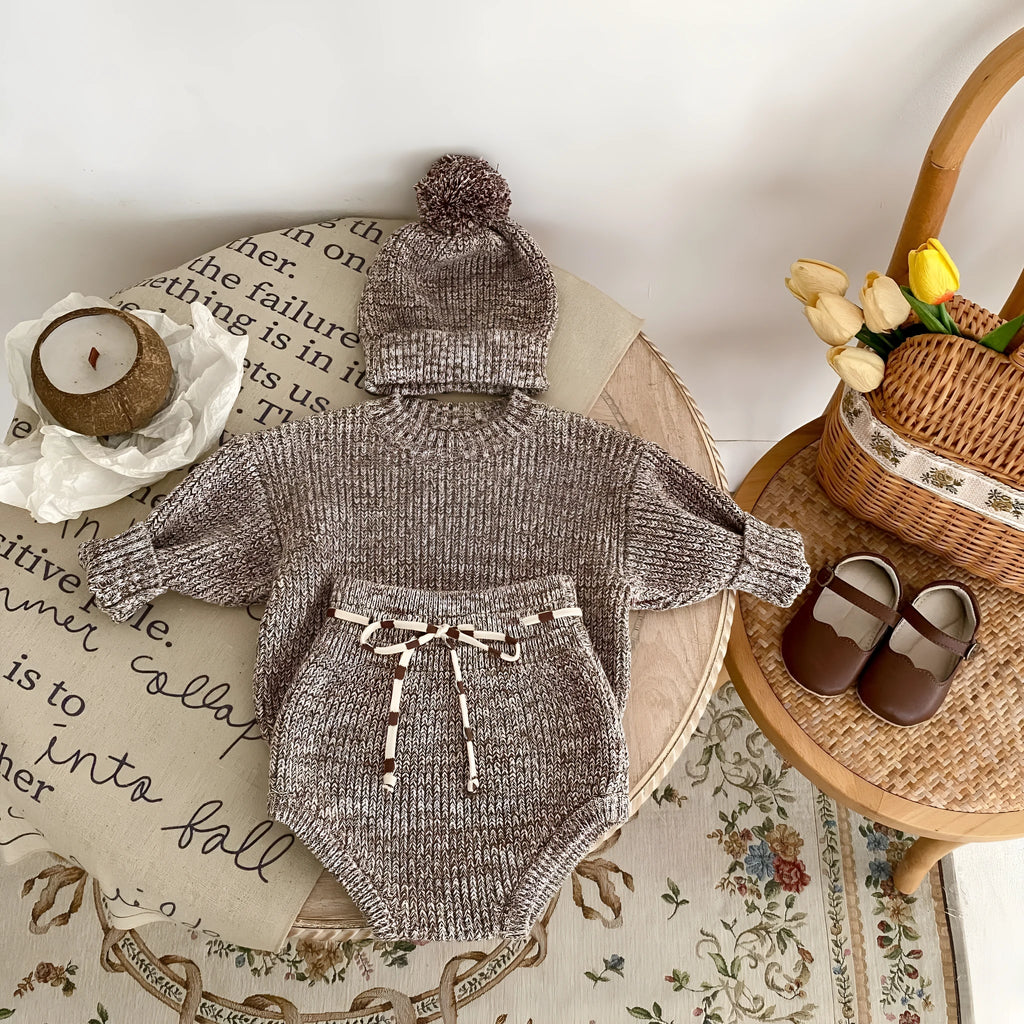 Dark brown baby girl three-piece clothing set with knitted hat, blouse and shorts