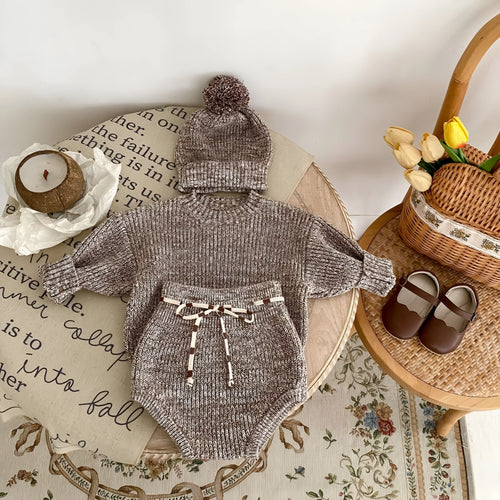 Dark brown baby girl three-piece clothing set with knitted hat, blouse and shorts