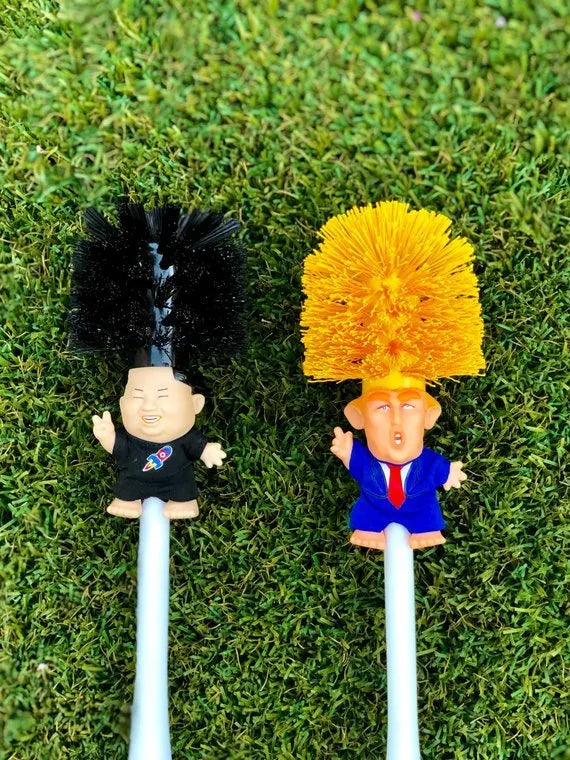 Yellow plastic Donald Trump novelty toilet brush with hanging slot, 40cm length