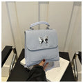 Women's PU leather backpack in multiple colours with bow detailing and hand-carrying option