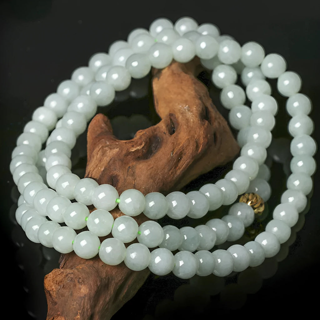 Adjustable jade bead necklace with white green round beads showing length adjustment from 21cm to 50cm