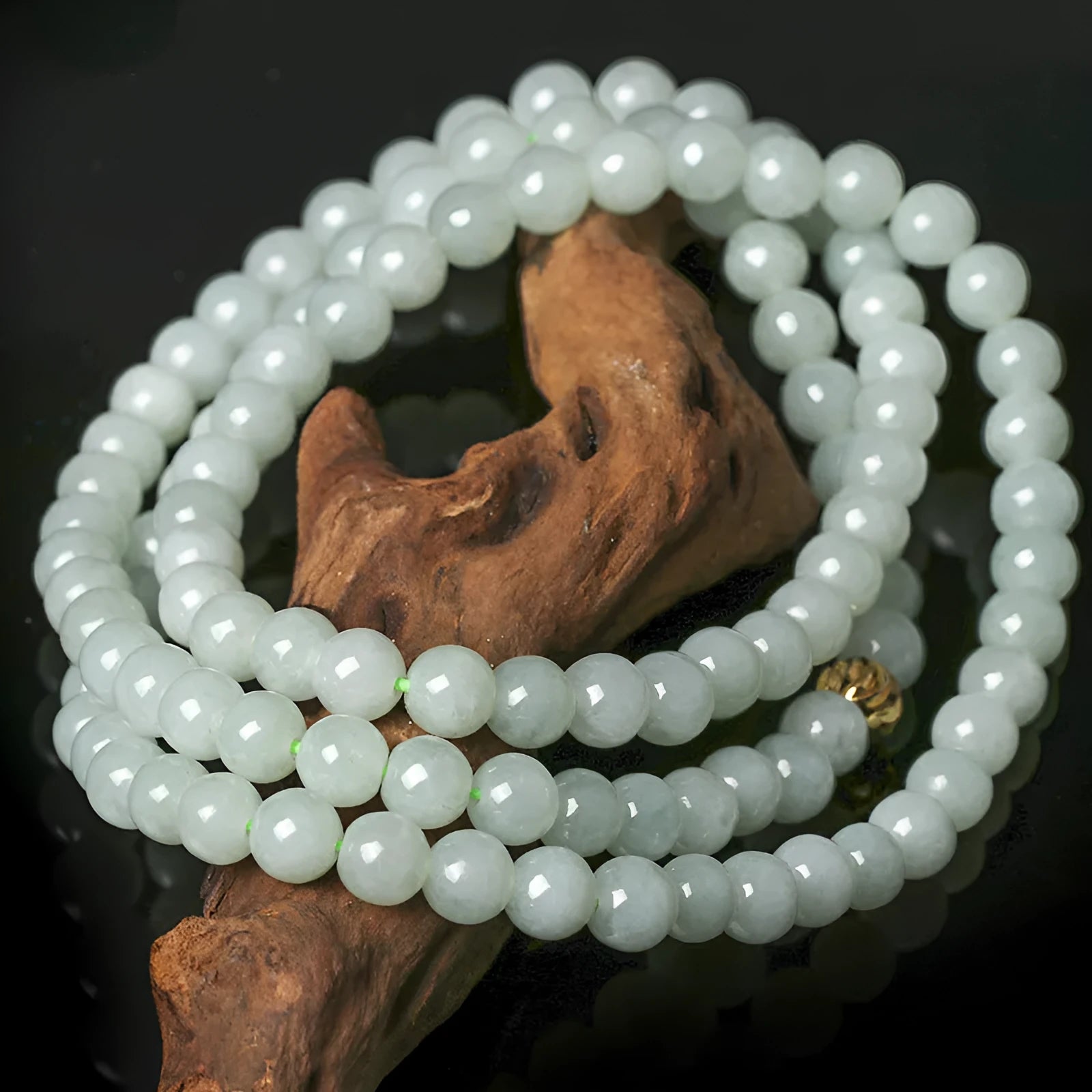 Adjustable jade bead necklace with white green round beads showing length adjustment from 21cm to 50cm