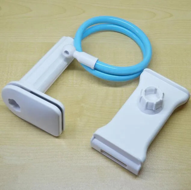 Black bedside phone handset with long adjustable arm and clamp base on a wooden table.