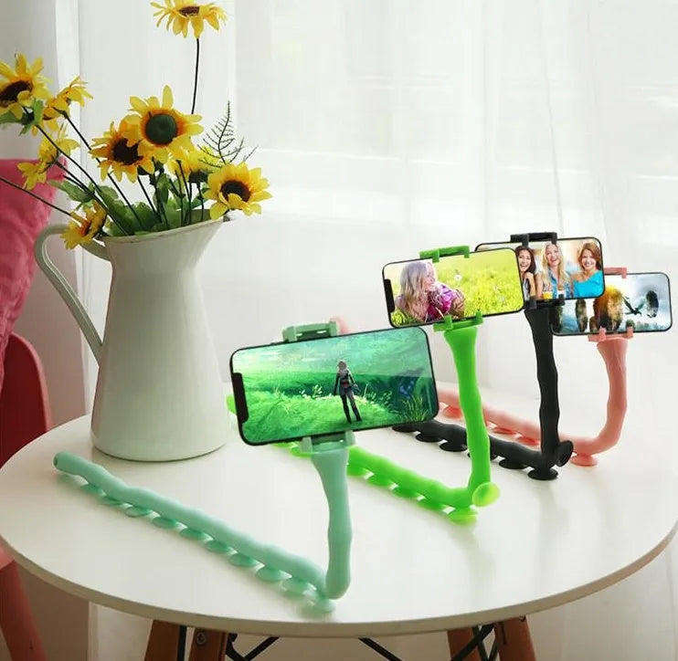 Black flexible rubber phone holder with suction cup bent into shape showing 62cm length