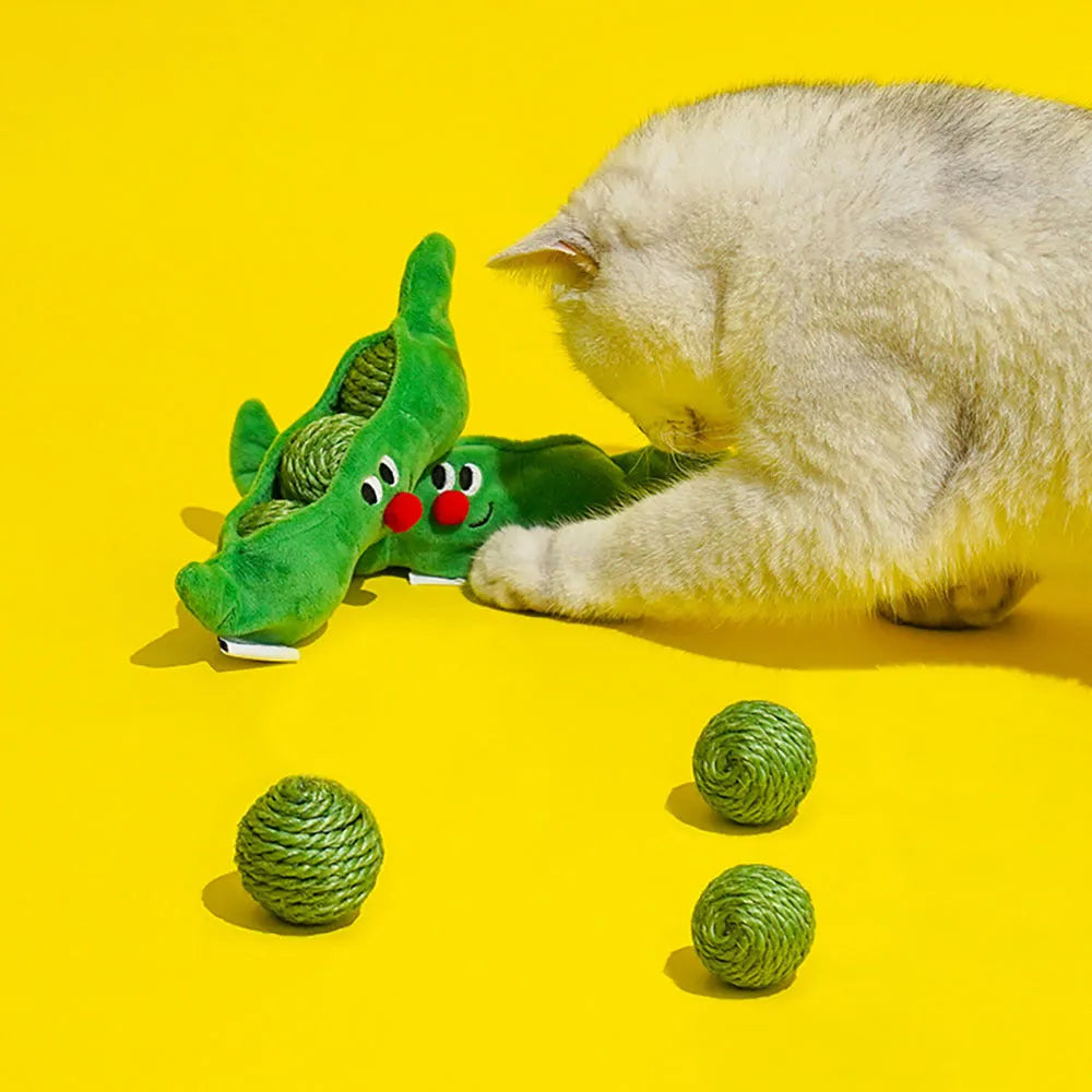 Three green sisal rope cat toy balls with rustling soundstone next to pea pod storage bag