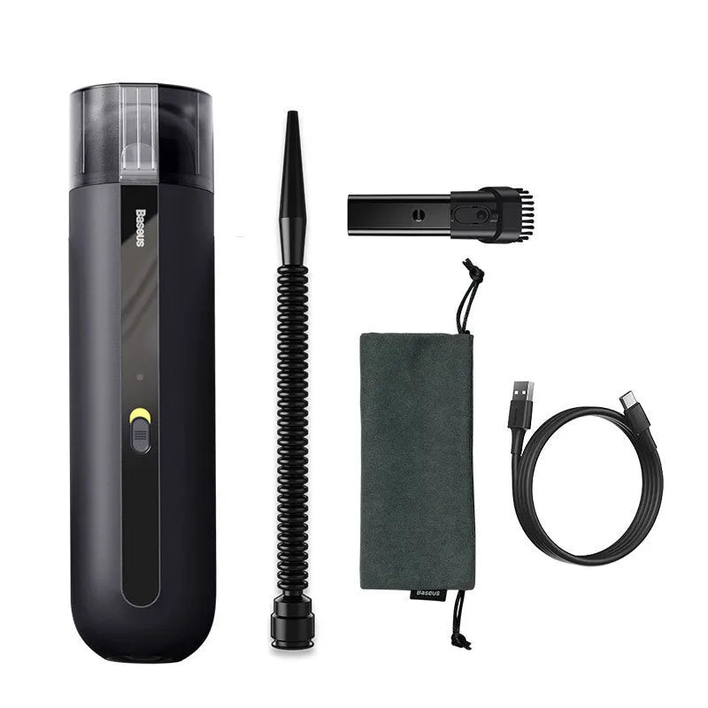 Starry sky black handheld cordless car vacuum cleaner with blowing hose accessory on a desktop.