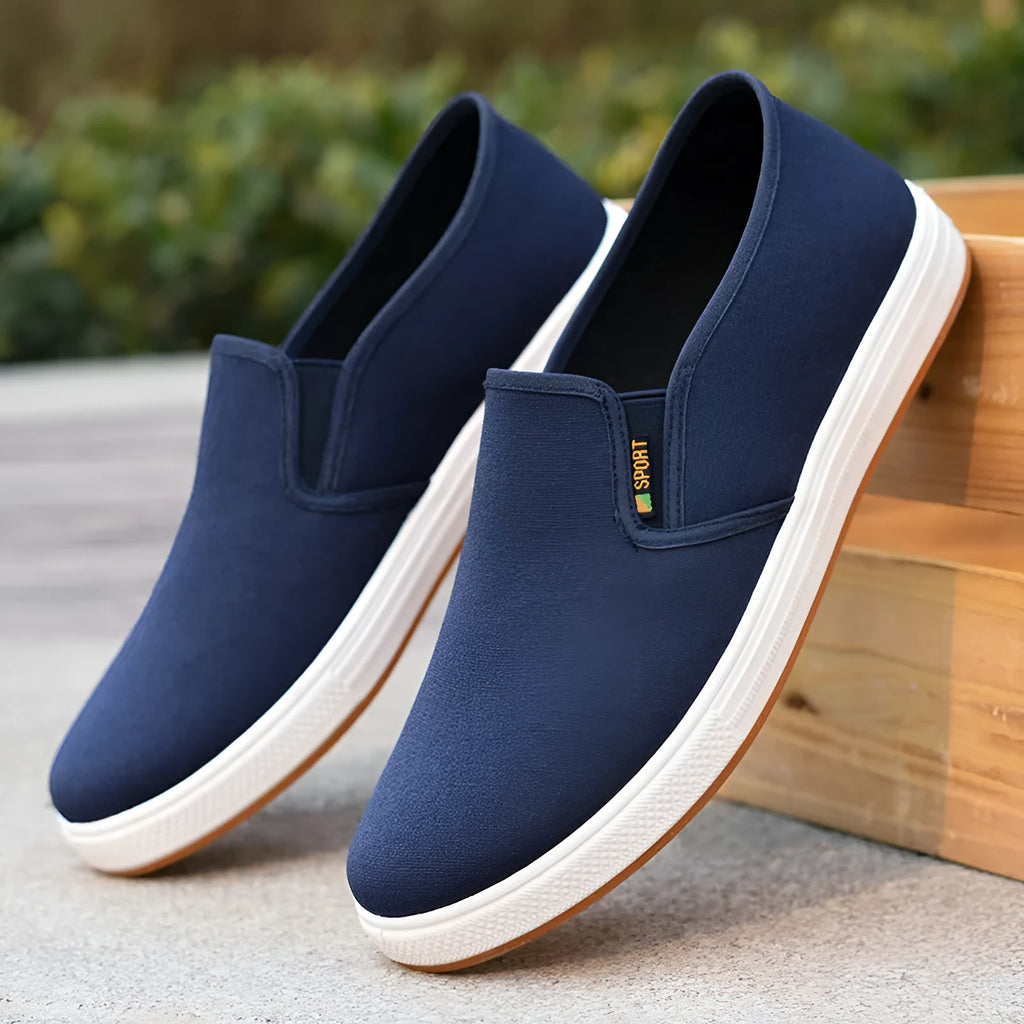Men's low-top canvas trainers with slip-on design and round toe shape in black colour