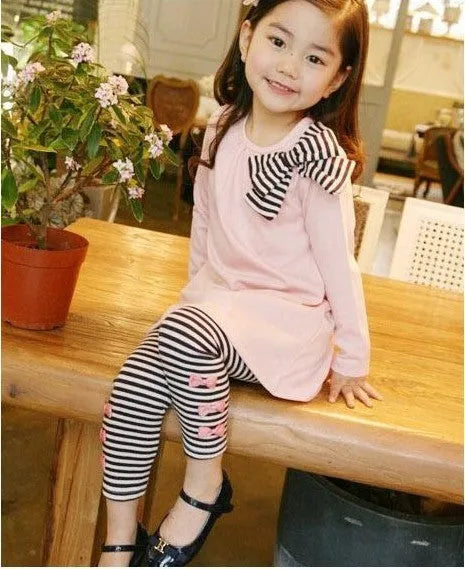 Pink cotton girls' clothing sets displayed in sizes 110cm, 120cm, 130cm and 140cm