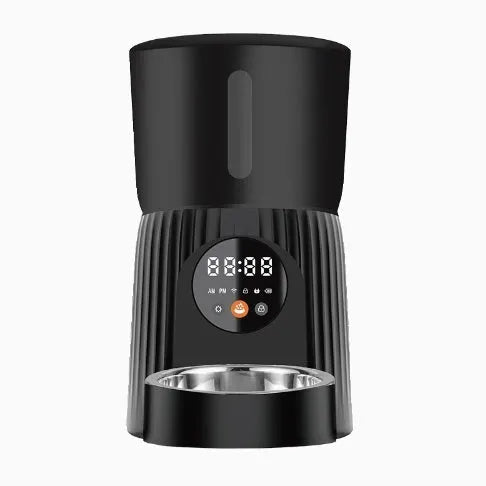 Black and white automatic pet feeder with digital display, food hopper, and USB cable.