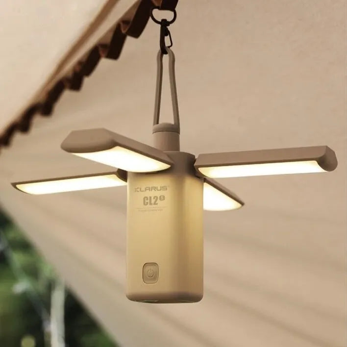 Green and white outdoor LED campsite lamp with USB charging cable and manual