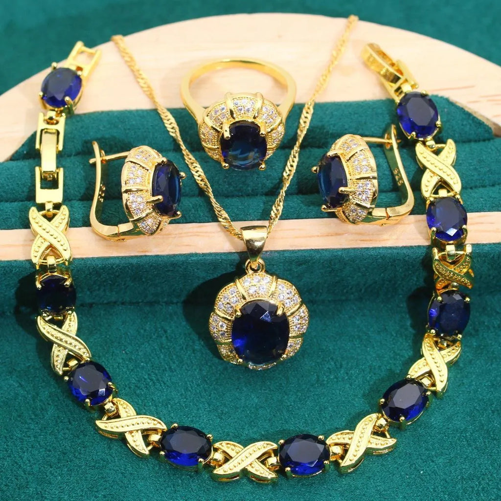 18k gold-plated necklace, earrings, ring, and bracelet set with colourful Raytheon-cut cubic zirconia stones.
