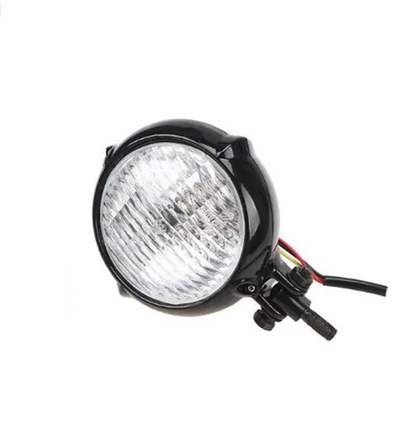 Black electroplated aluminium 12V 35W halogen headlight with an 8cm diameter.