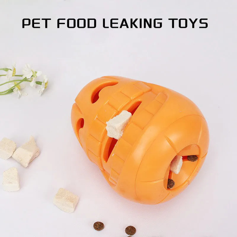 Orange Halloween pumpkin shaped rubber dog toy with a treat-dispensing funnel hole.