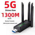 Black USB network transmitter with four extended antennas for wireless computer connectivity