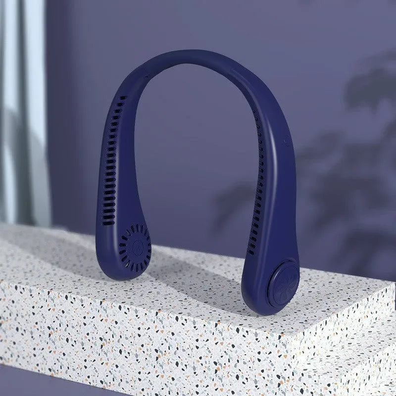 White portable bladeless neck fan hanging ergonomically with USB charging cable.