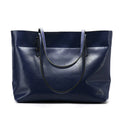 Brown waxed cowhide leather women's crossbody handbag with a structured shape and a front flap.