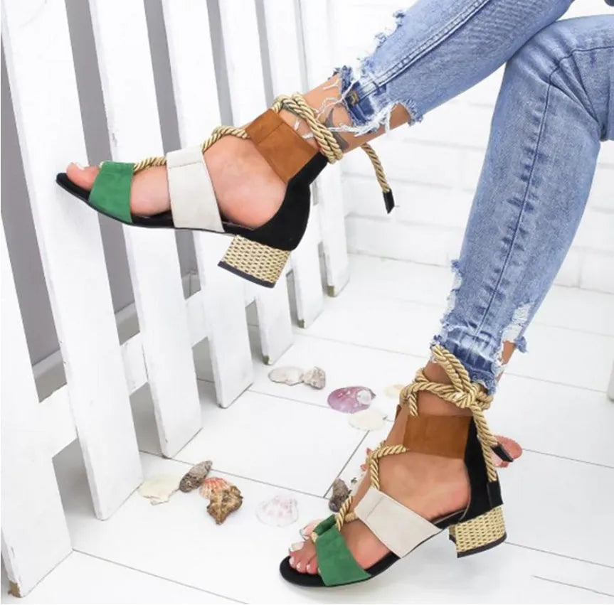 Women's beige suede sandals with front strap, thick middle heel, and ankle strap.