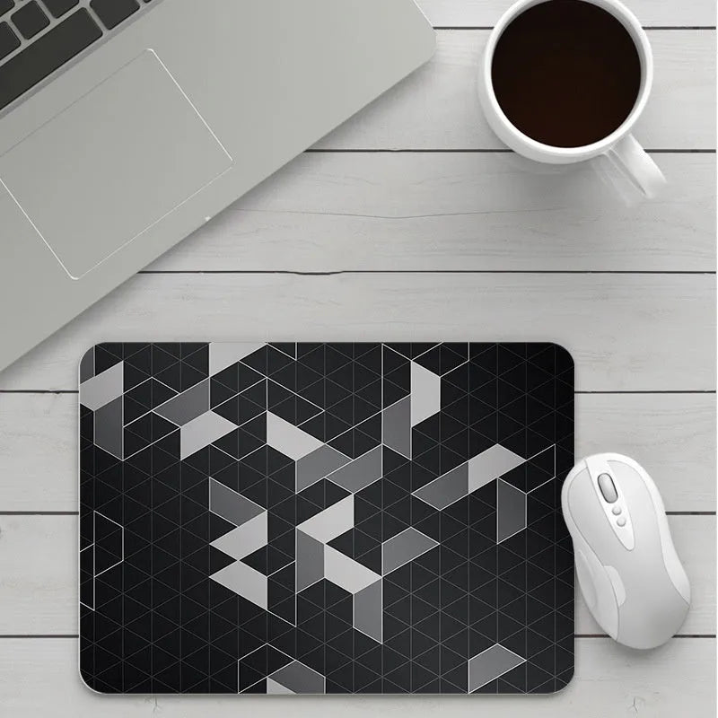 Thick custom cartoon mouse pad with colourful design on a desk, showing black seam edge