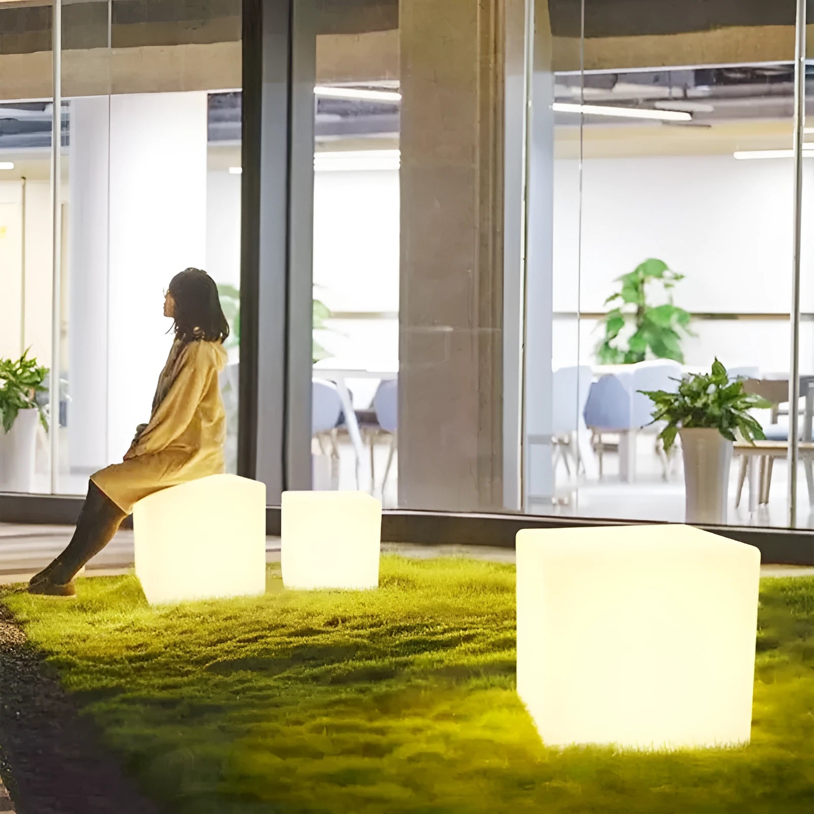 A modern square LED cube light stool for outdoor gardens, available in multiple sizes.