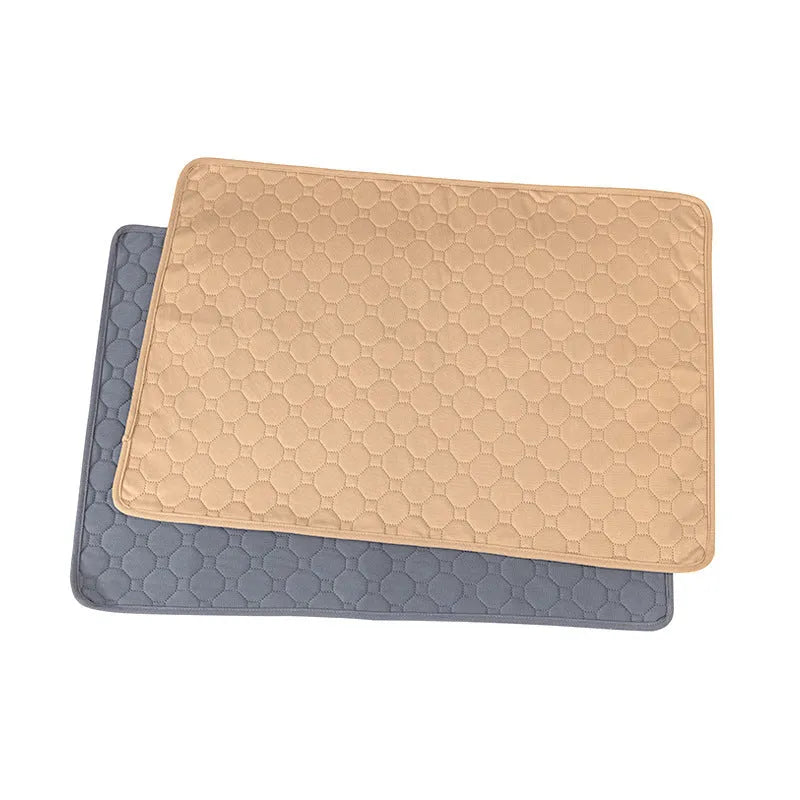 Washable dog pee pads in grey and tan colours showing waterproof backing and triple-stitch edges