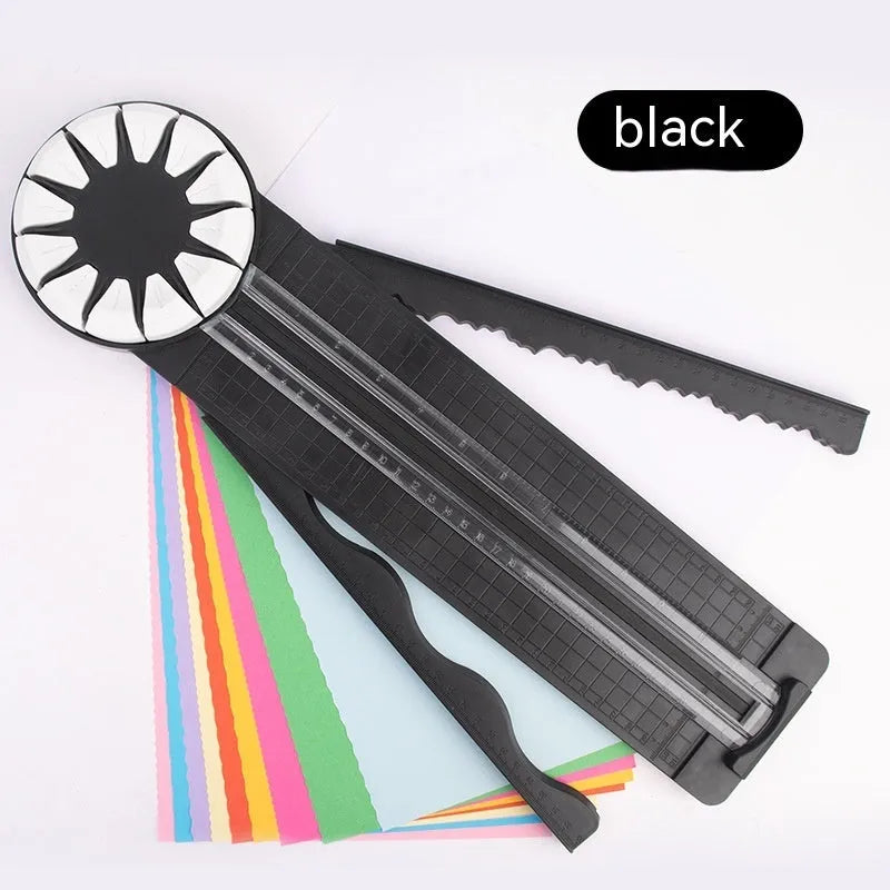 Pink and black 12-in-1 decorative edge paper cutting machine for A4 paper on a desk.