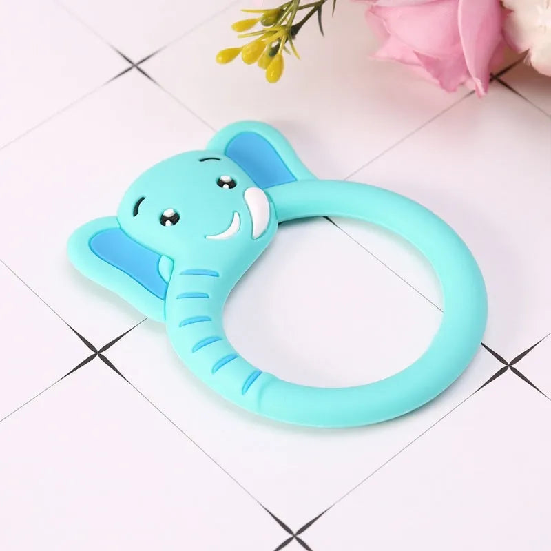 Three silicone baby molar teethers in brown, blue, and yellow on a white background