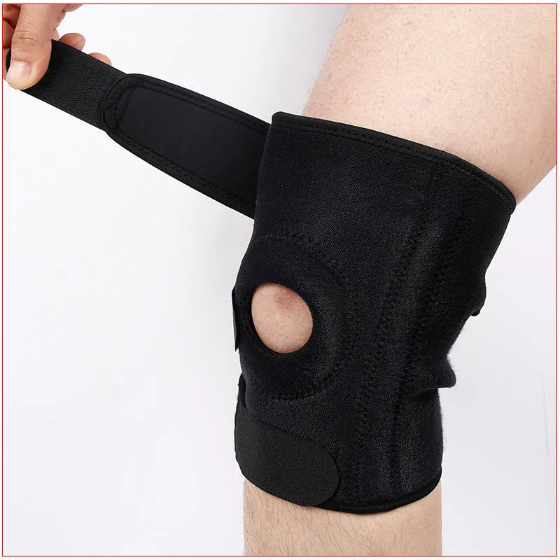 Close-up view of a grey nylon spring support knee pad on a person's knee, showing the fabric texture and strap.